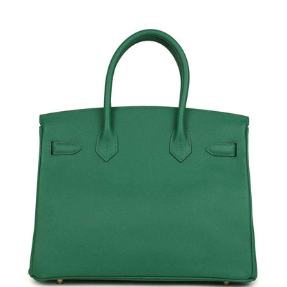 Elegant green leather handbag with a timeless, sophisticated silhouette