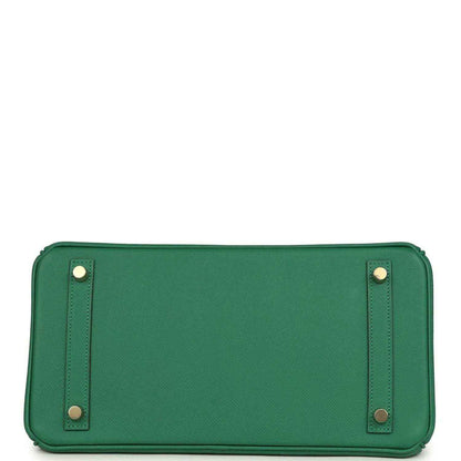 Elegant green leather handbag base with gold-tone metal feet, timeless and sophisticated.