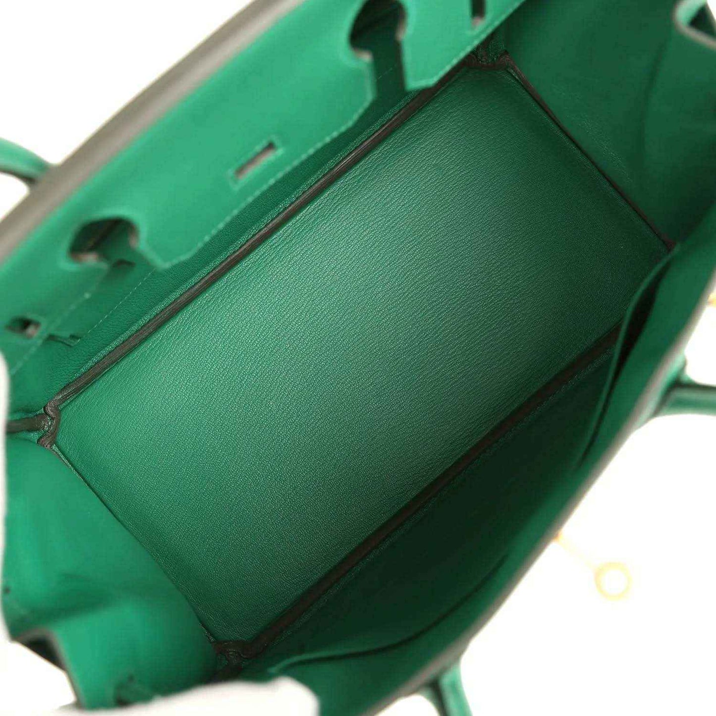 Timeless emerald green leather handbag interior, elegant and sophisticated design.
