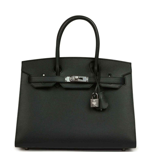 Timeless black leather handbag with elegant silver hardware and structured silhouette.
