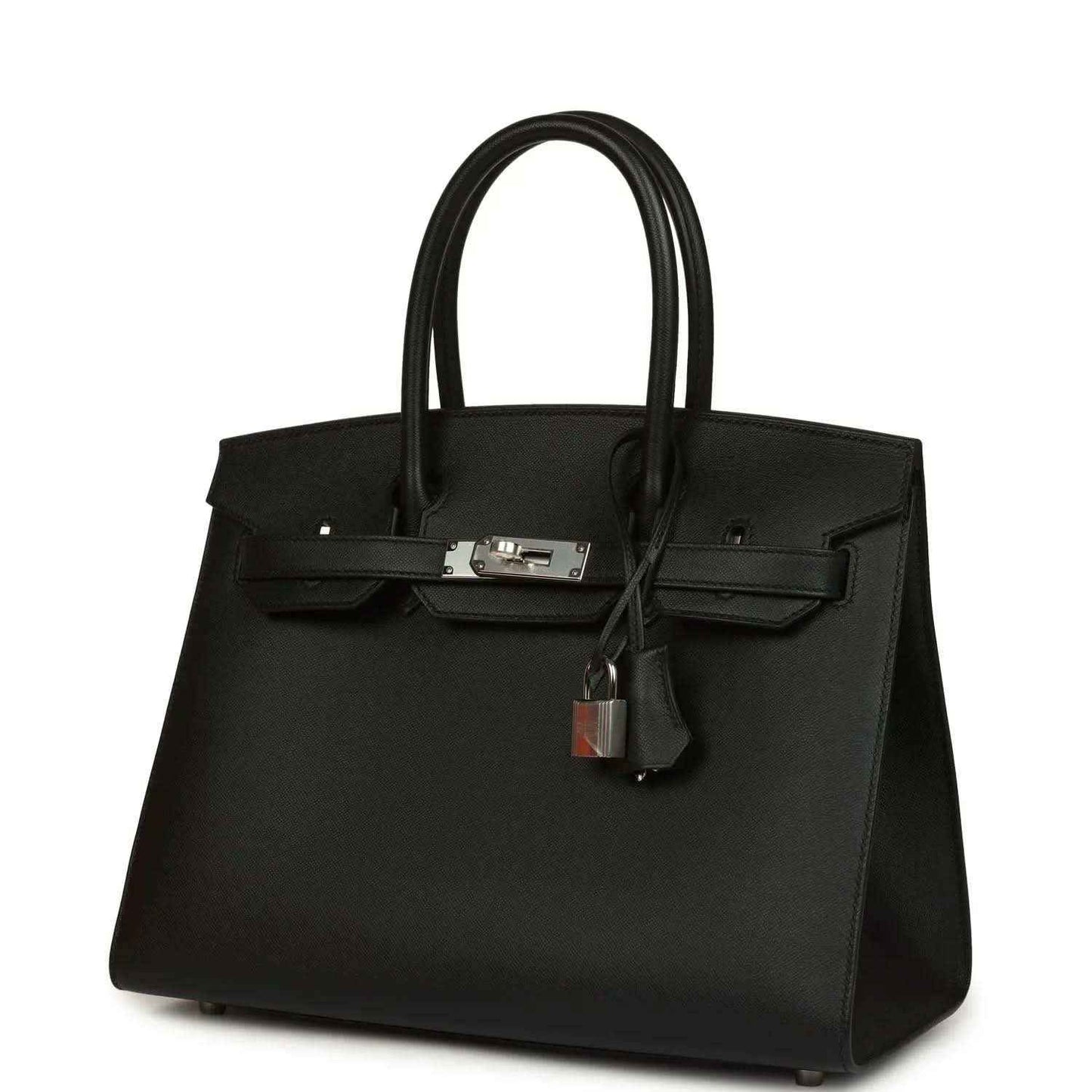 Timeless black leather handbag with silver hardware, elegant and sophisticated design.
