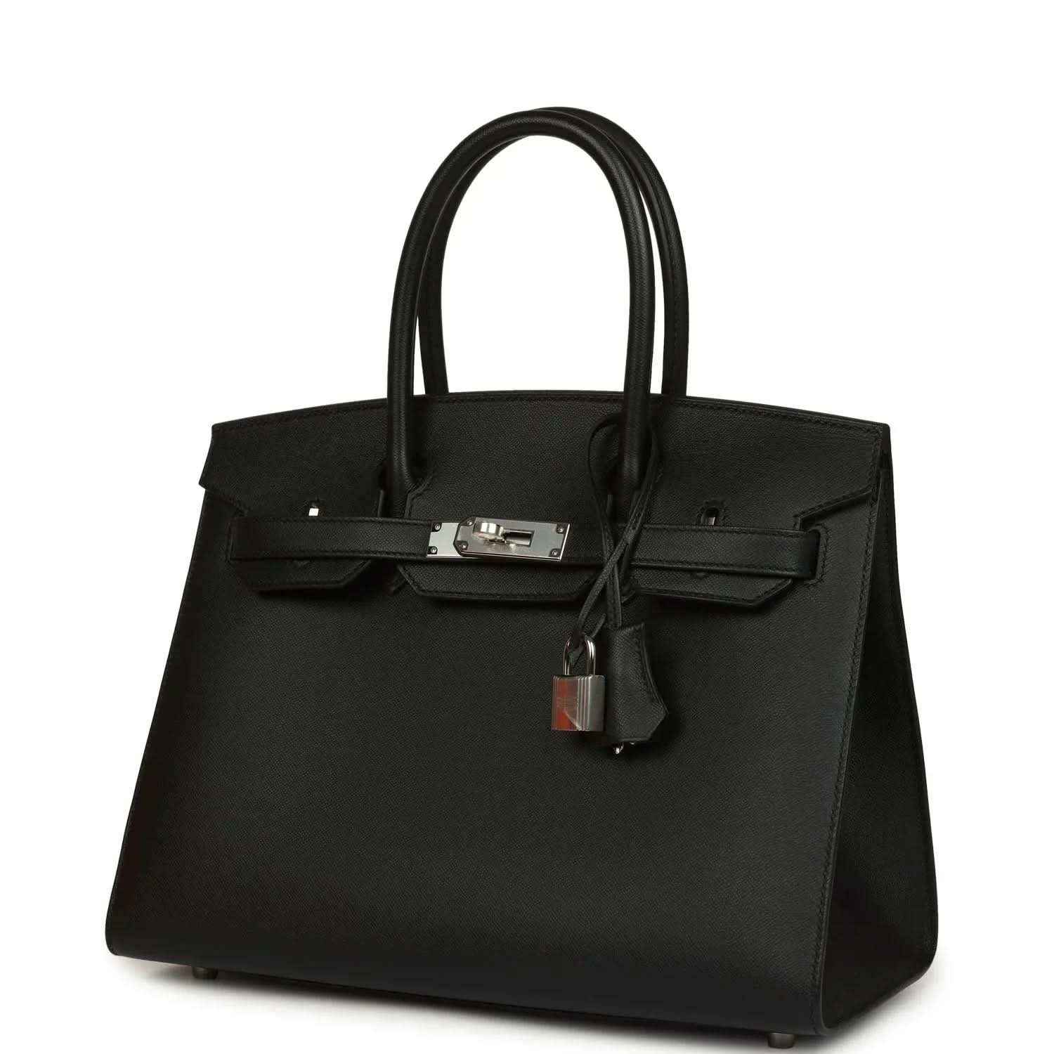 Timeless black leather handbag with silver hardware, elegant and sophisticated design.