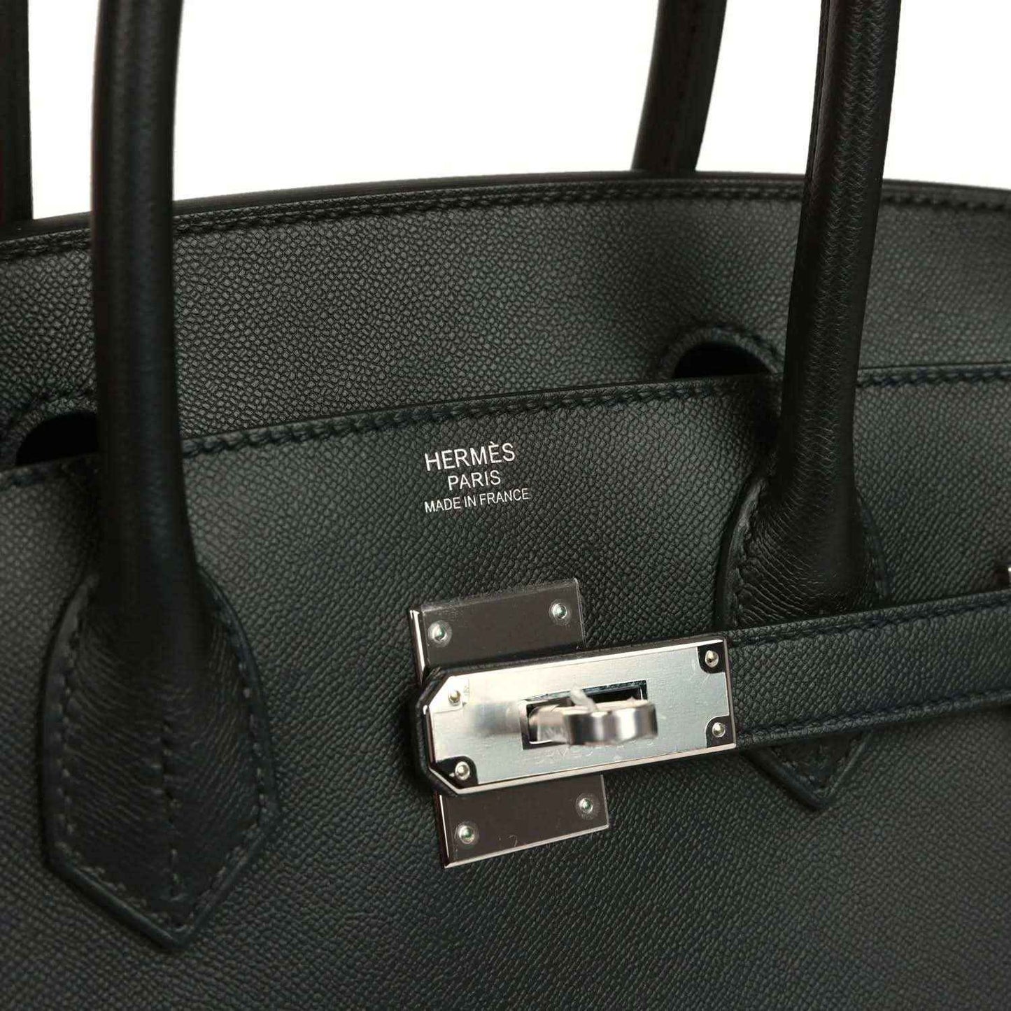 Elegant black leather handbag with silver hardware and timeless, sophisticated design