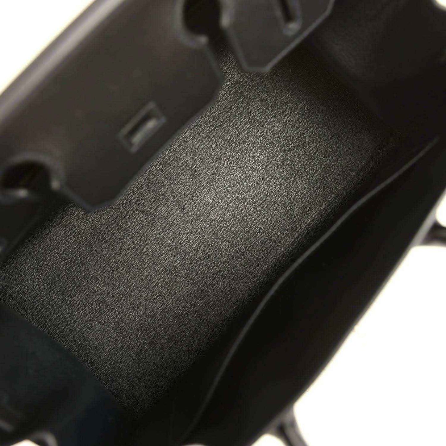 Interior view of a timeless black leather handbag with elegant, refined finish.