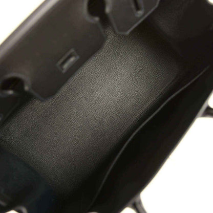 Interior view of a timeless black leather handbag with elegant, refined finish.