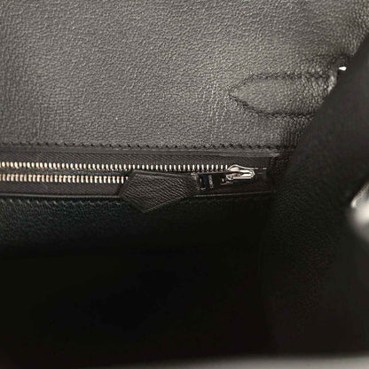 Elegant black leather handbag interior with sophisticated zipper detailing