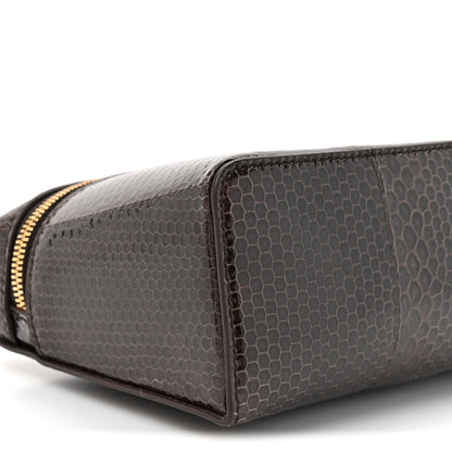Loro Piana lizard leather pouch corner with gold zipper pull, dark brown finish