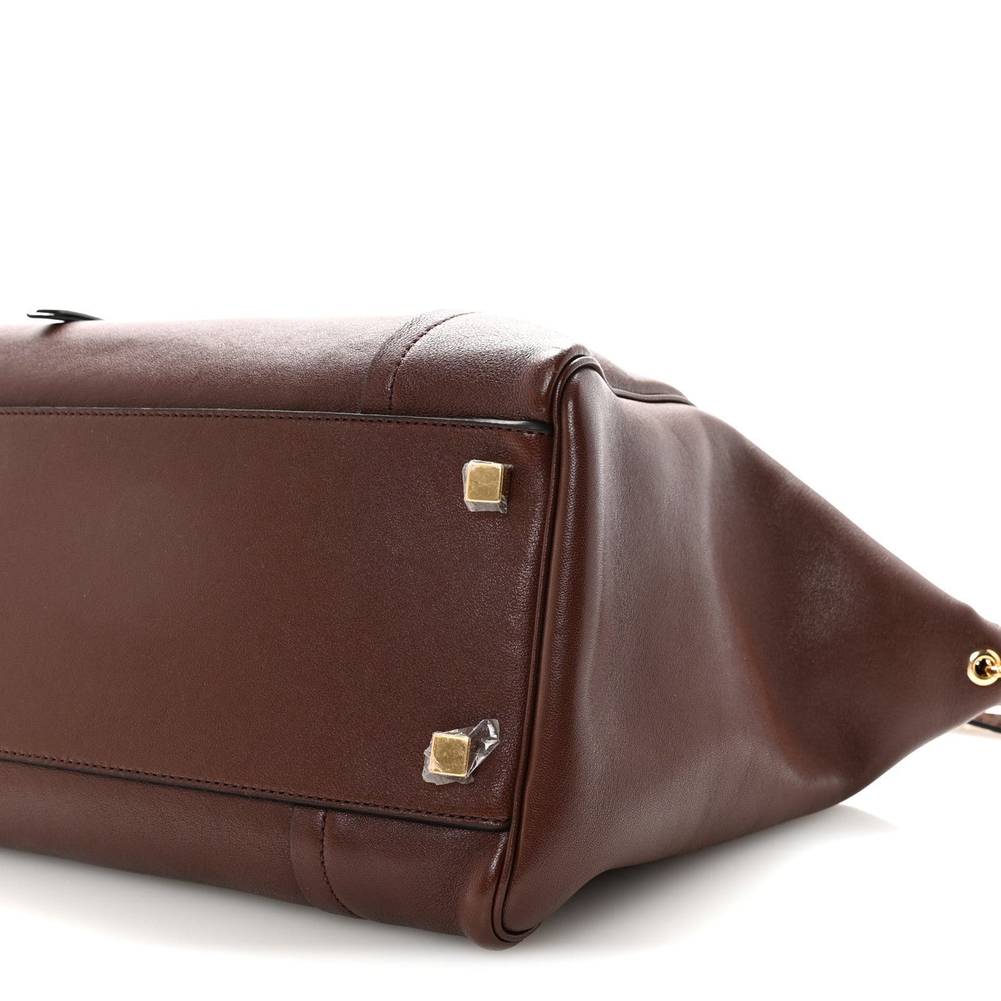 Dark brown lambskin handbag end panel with gold studs and curved leather edge