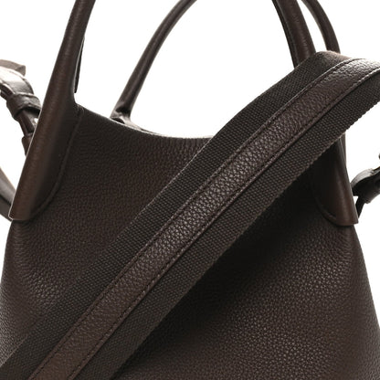 Dark brown grained calfskin small bale bag with textured shoulder strap and top handle