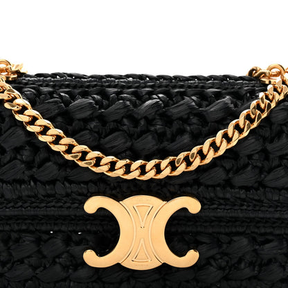 Close-up of gold chain and black woven flap with CC logo