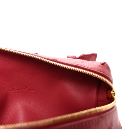 Loro Piana ostrich pouch fuchsia with red interior and gold zipper edge