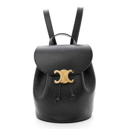 Celine Triomphe calfskin Bonnie backpack in black with gold logo and drawstring.