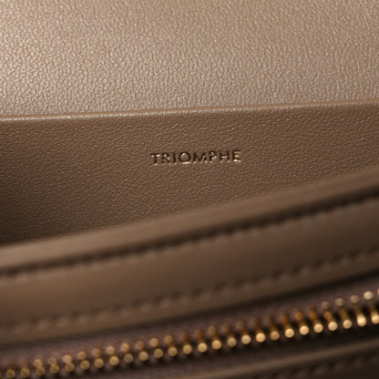 Triomphe embossed on beige leather