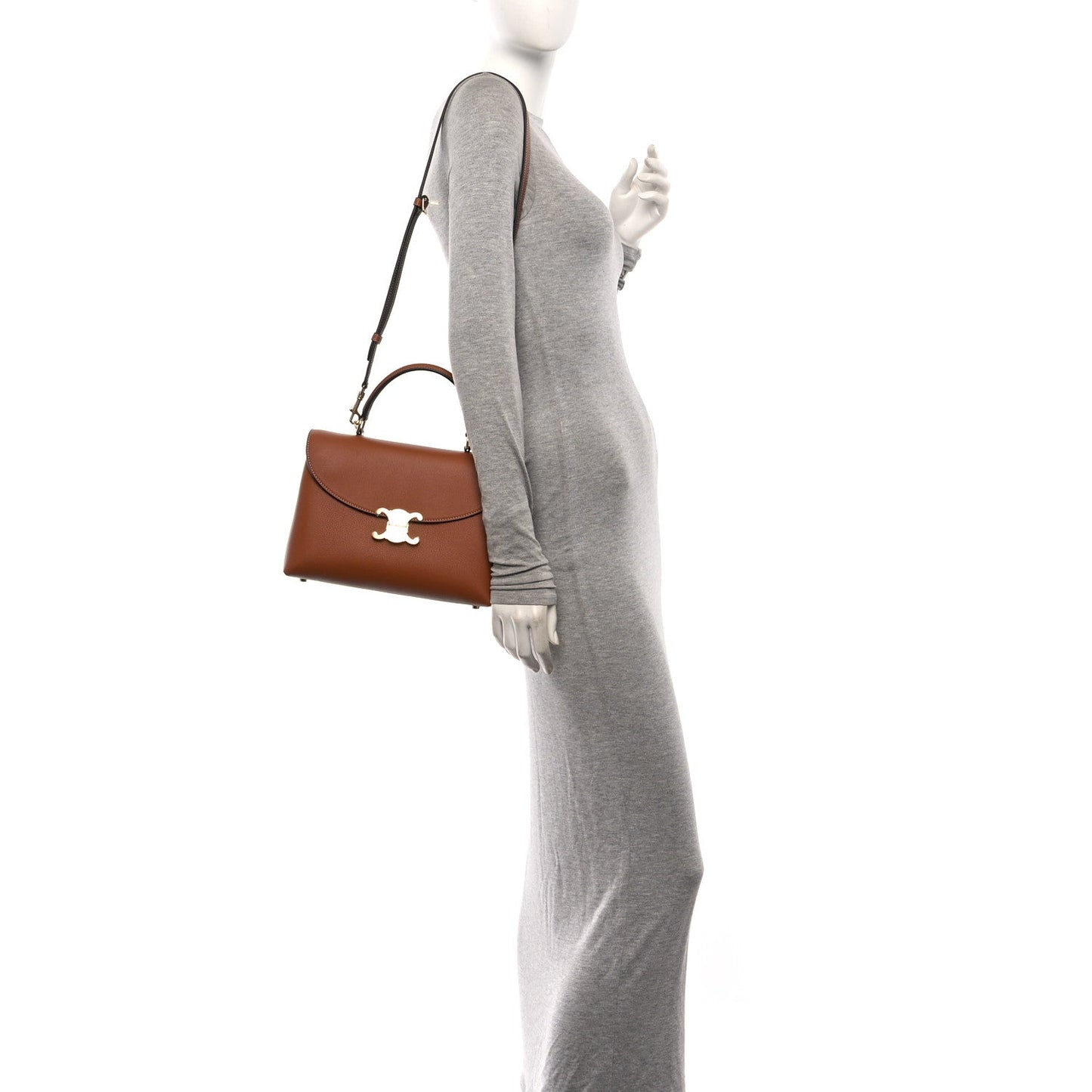 Tan leather medium handbag with top handle and long crossbody strap, gold logo clasp