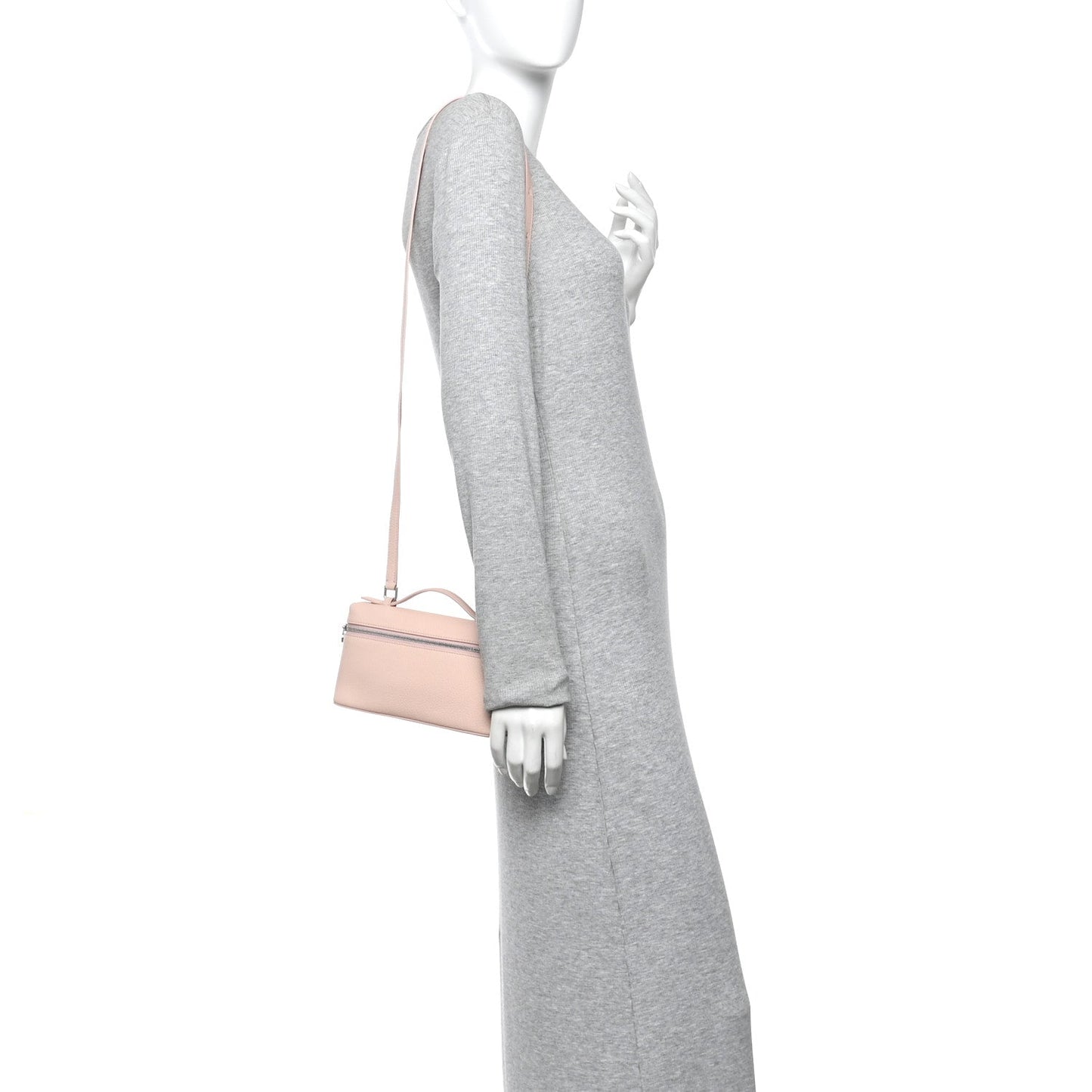 Light pink leather pouch with crossbody strap shown on model