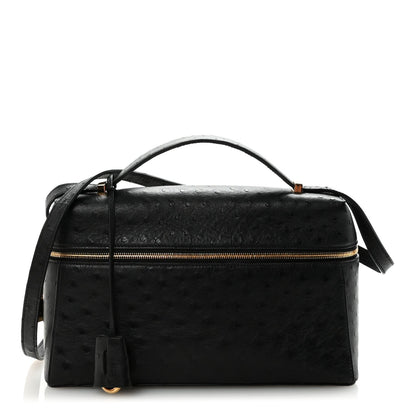 Black ostrich leather mini handbag with top handle, front zip, and adjustable shoulder strap