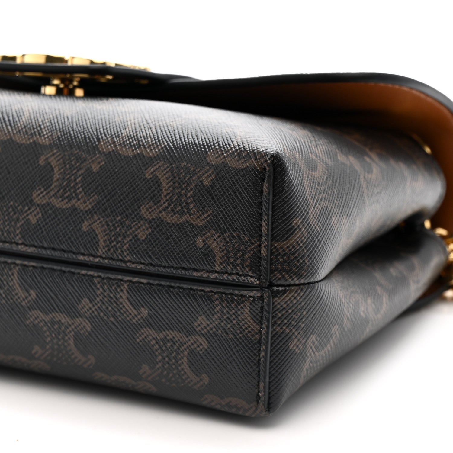Celine Triomphe shoulder bag bottom corner close-up with dark canvas and gold-toned detail