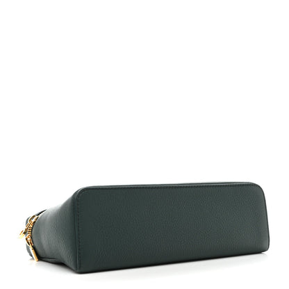 Grained calfskin pouch in dark green with rounded shape and visible gold zipper end.