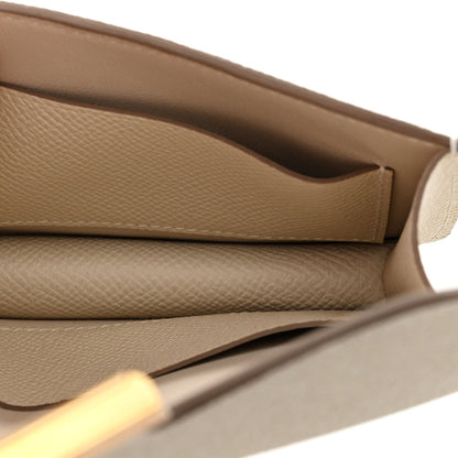Slim wallet interior with stitched seam, light cream textured leather