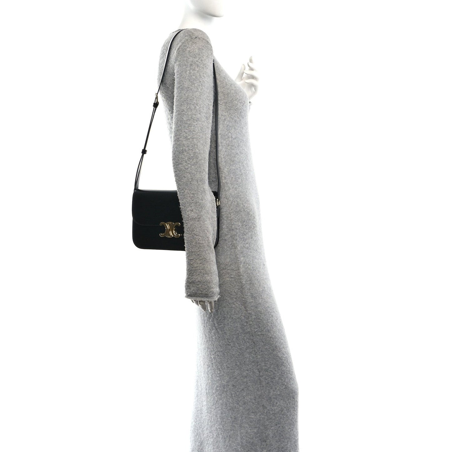 Shiny calfskin shoulder bag in black worn crossbody with gold hardware on flap