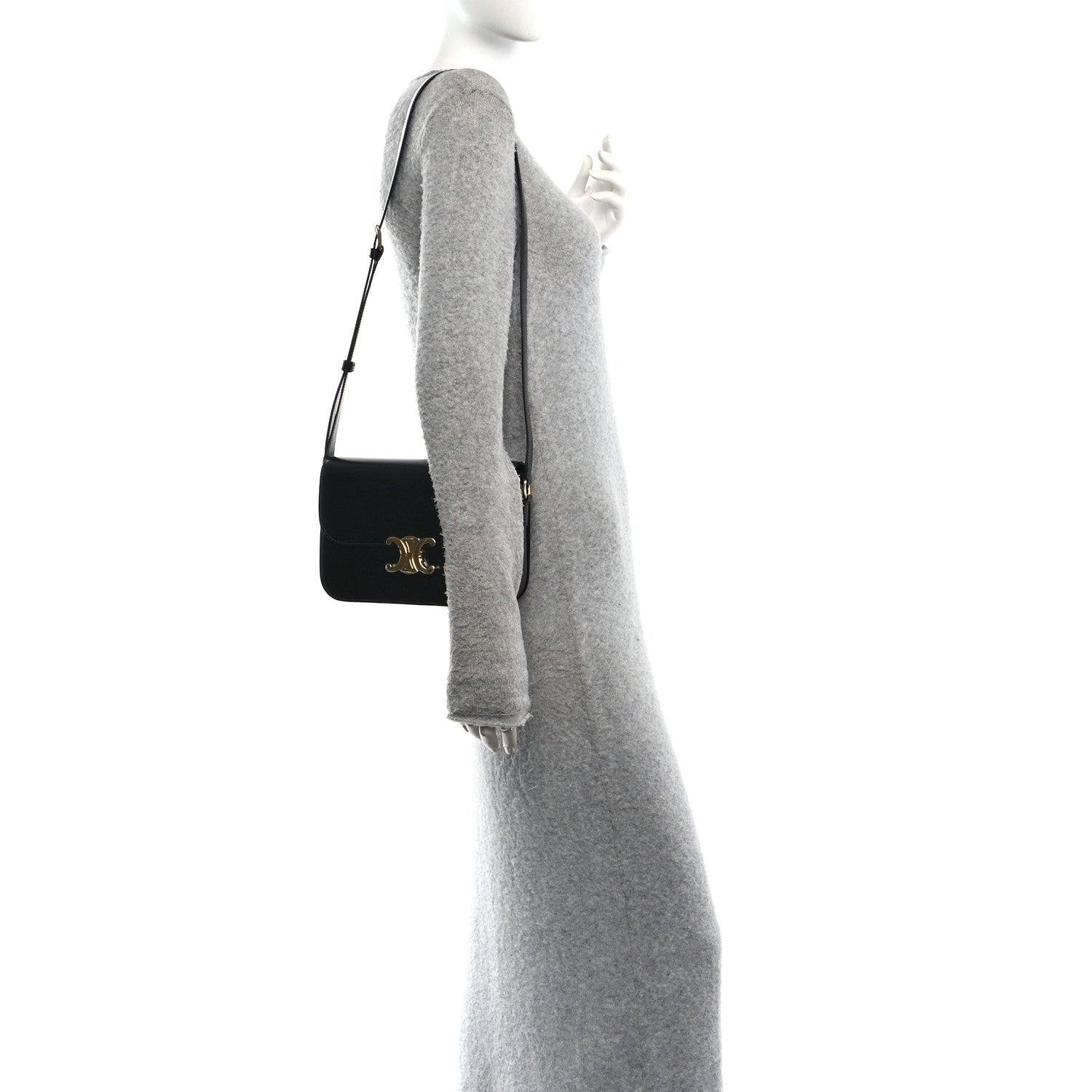 Shiny calfskin shoulder bag in black worn crossbody with gold hardware on flap