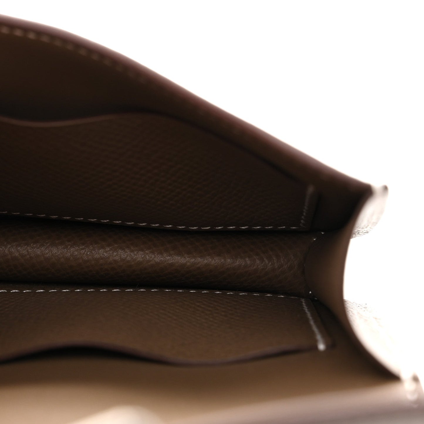 Taupe leather interior edge view with white contrast stitching