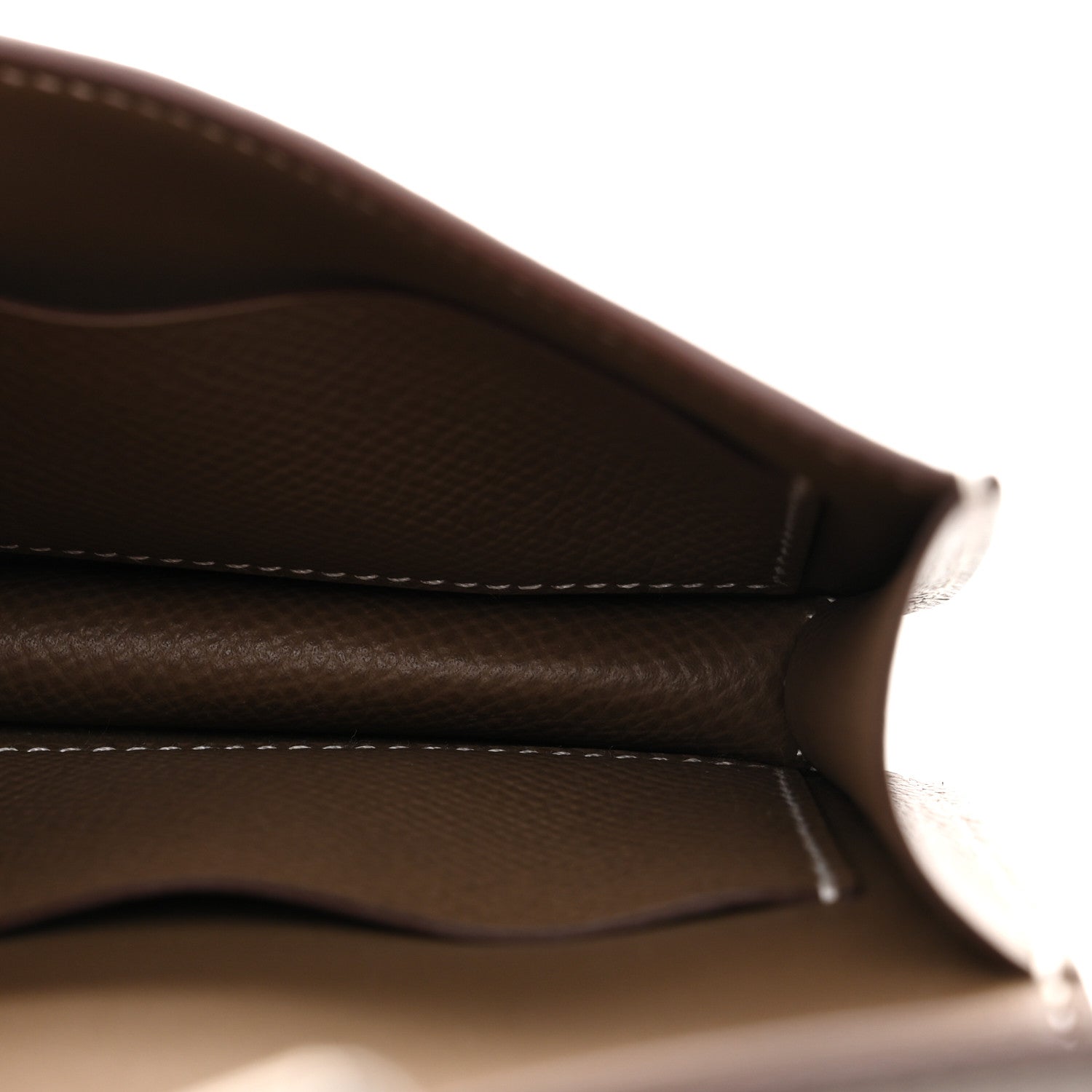 Taupe leather interior edge view with white contrast stitching