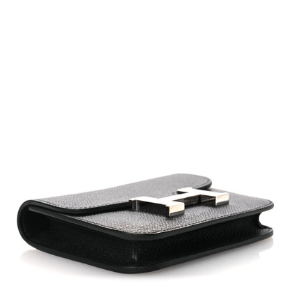 Black slim leather wallet open, showing interior card slots