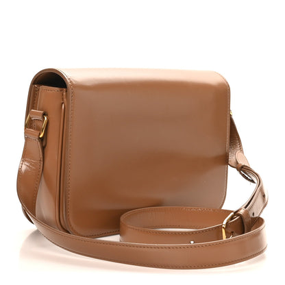 Bronze shiny calfskin shoulder bag, front flap with gold-tone Triomphe emblem