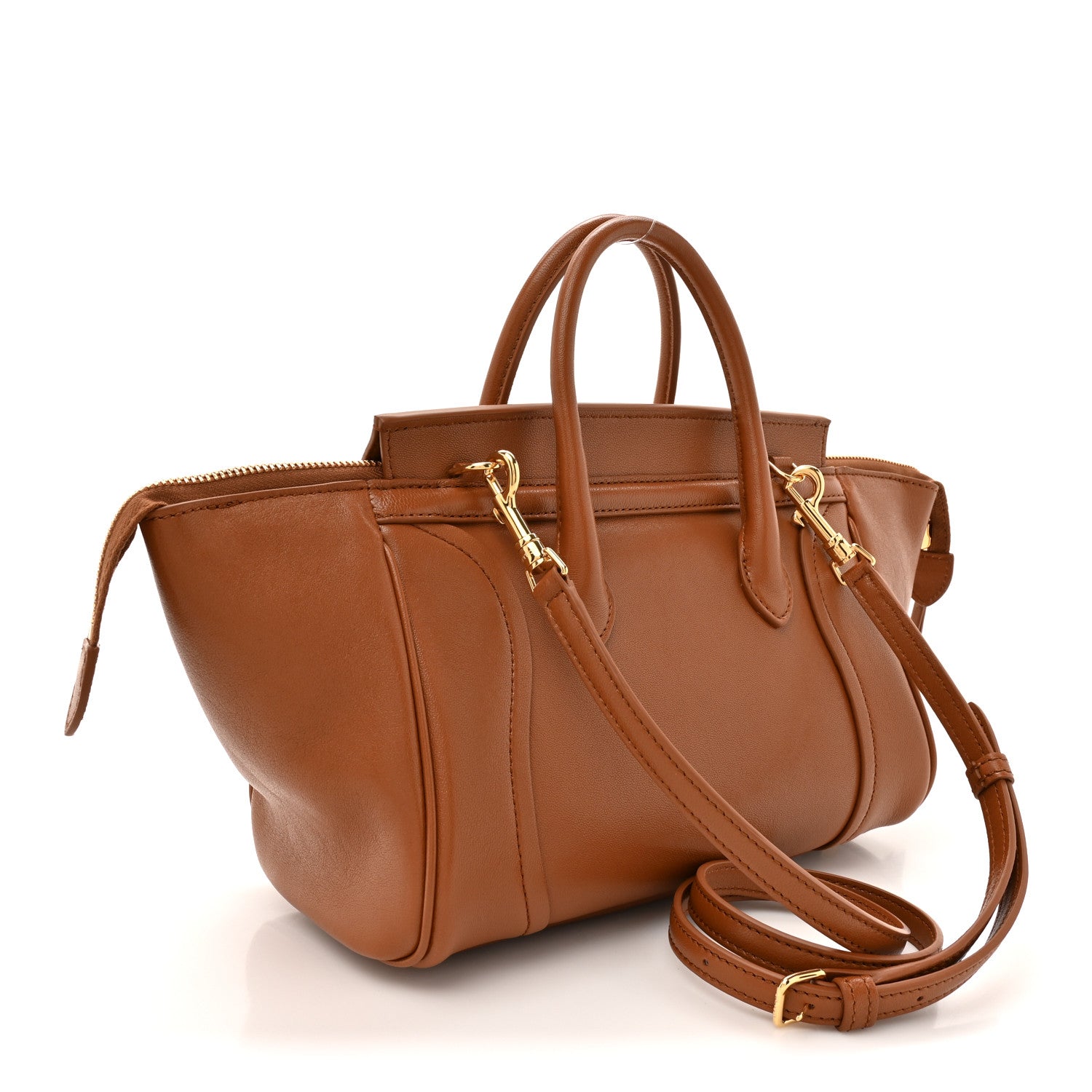 Tan leather small handbag with crossbody strap and gold-tone zippers and hardware.