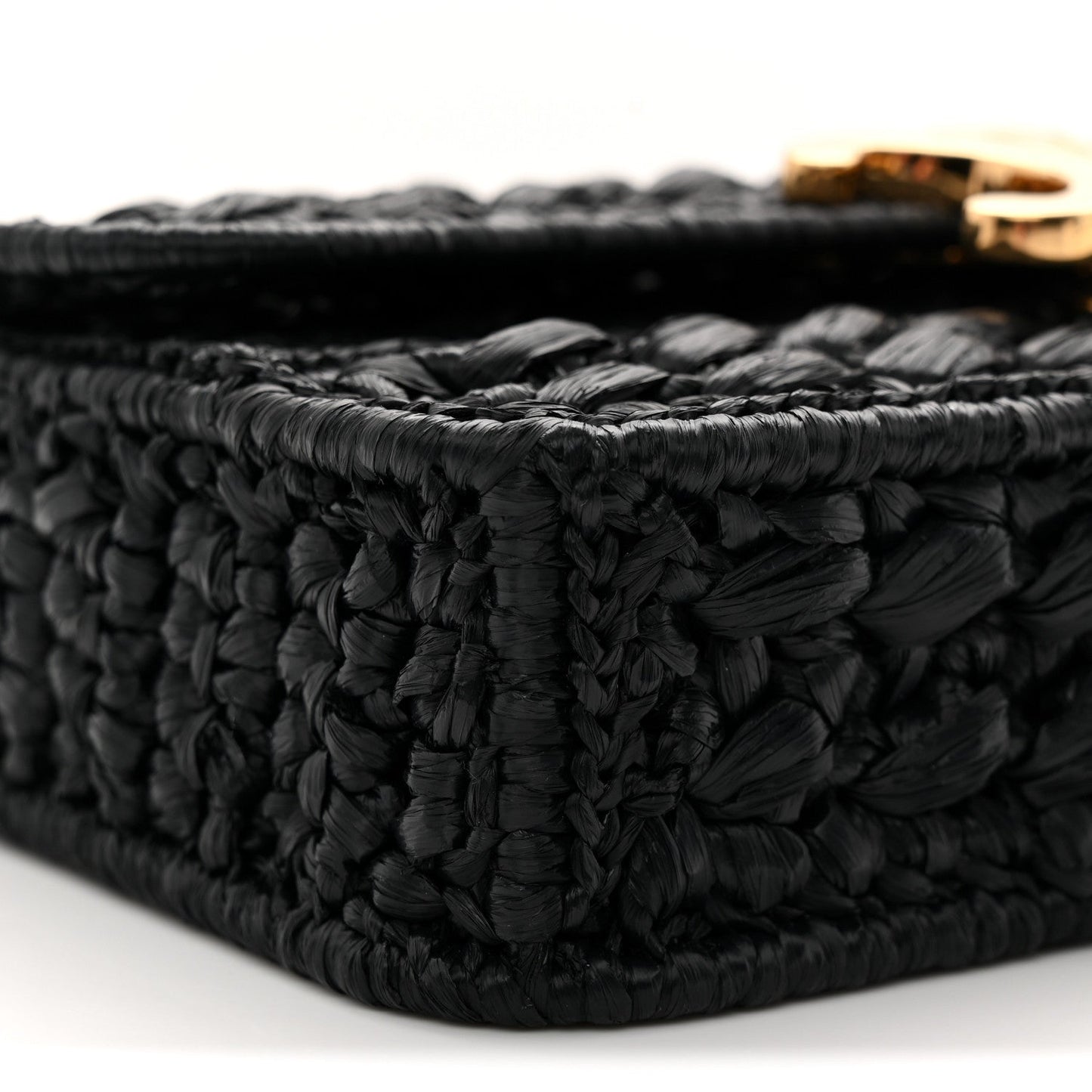 Black raffia-effect woven corner detail with raised texture