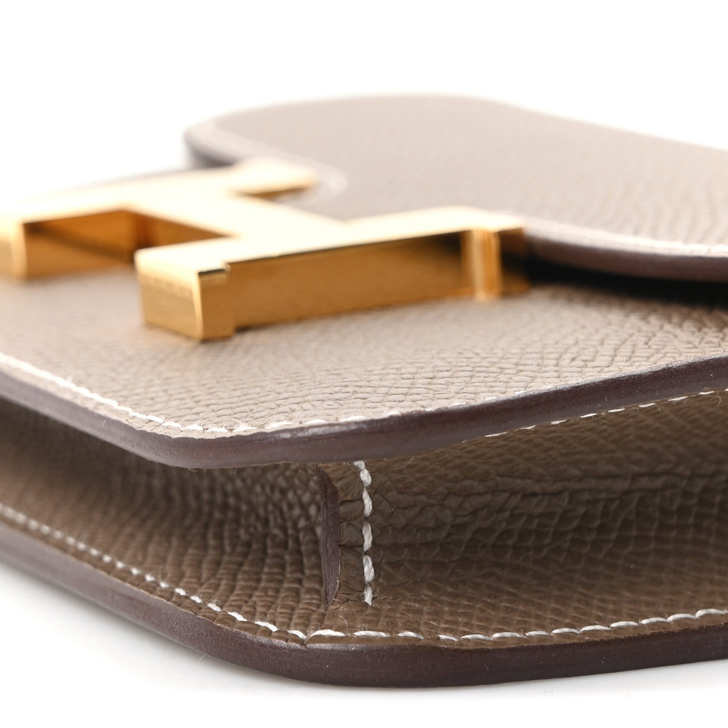 Hermes Constance slim wallet close-up of gold clasp and edge stitching
