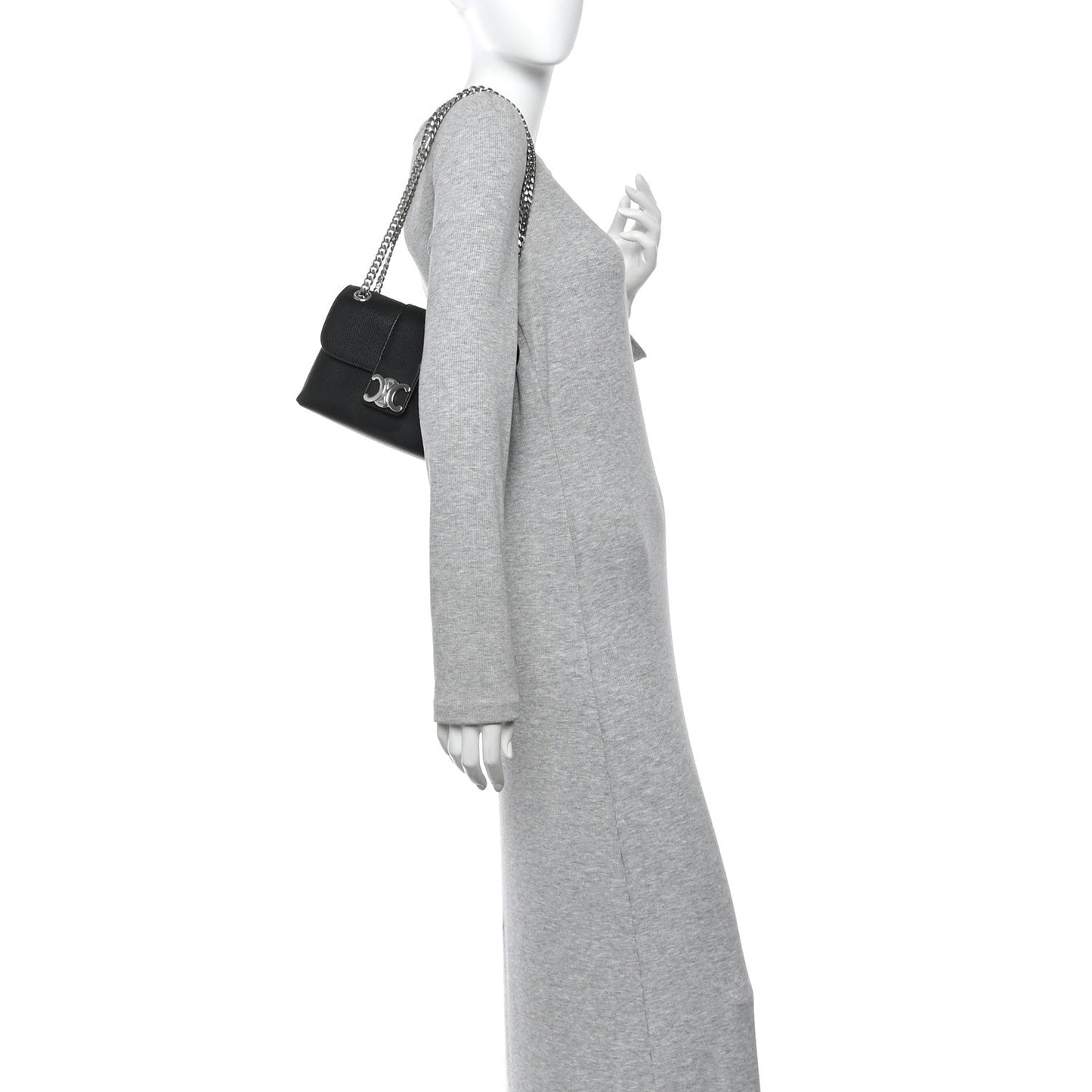 Black leather shoulder bag with chain strap, worn crossbody by model
