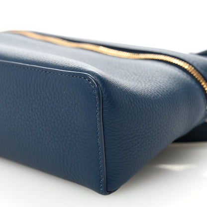 Navy grained calfskin pouch base corner with gold zipper trim