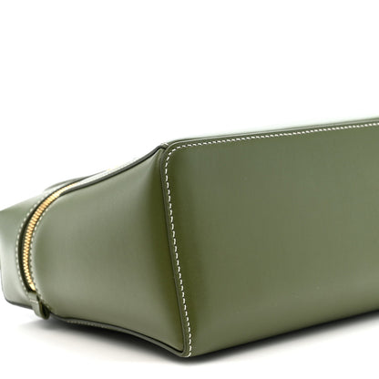 Olive green leather handbag side panel with curved seam and contrast edge stitching