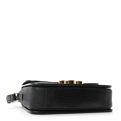 Black lizard-embossed flap bag base with gold-tone hardware and strap attachment