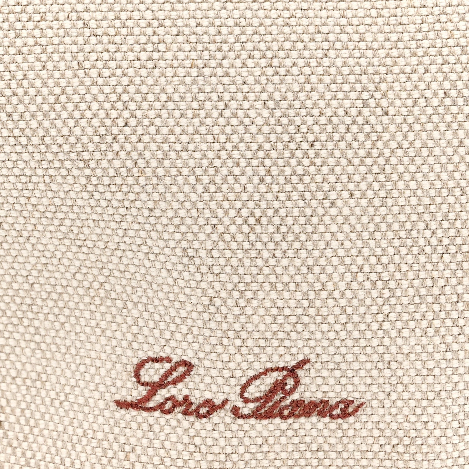 Natural canvas fabric with red-brown Loro Piana logo embroidery.