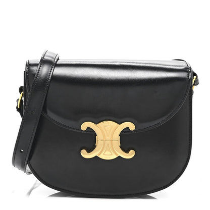 Black shiny calfskin flap crossbody bag with gold Triomphe emblem and shoulder strap