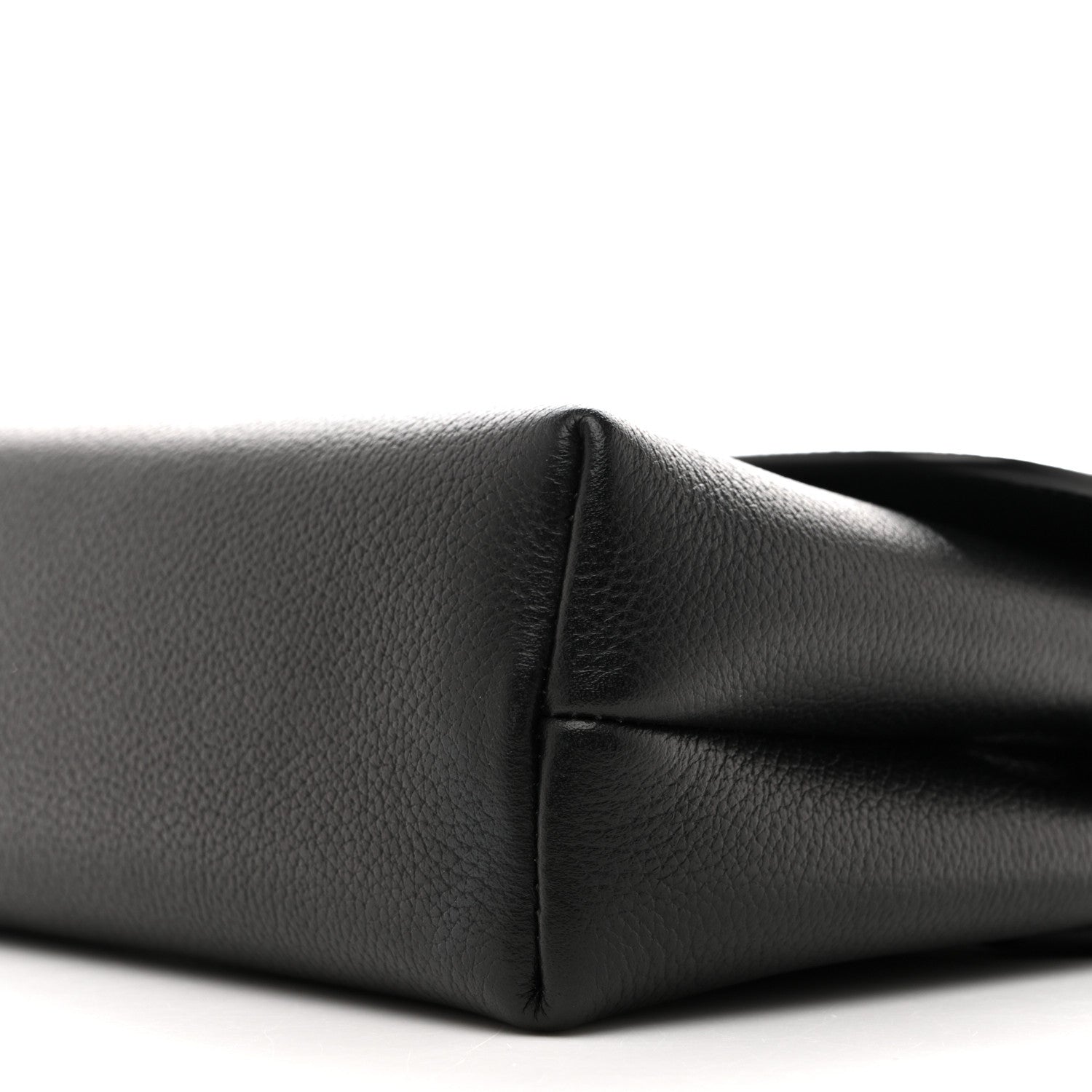 Black calfskin shoulder bag, close-up of side seam and curved corner