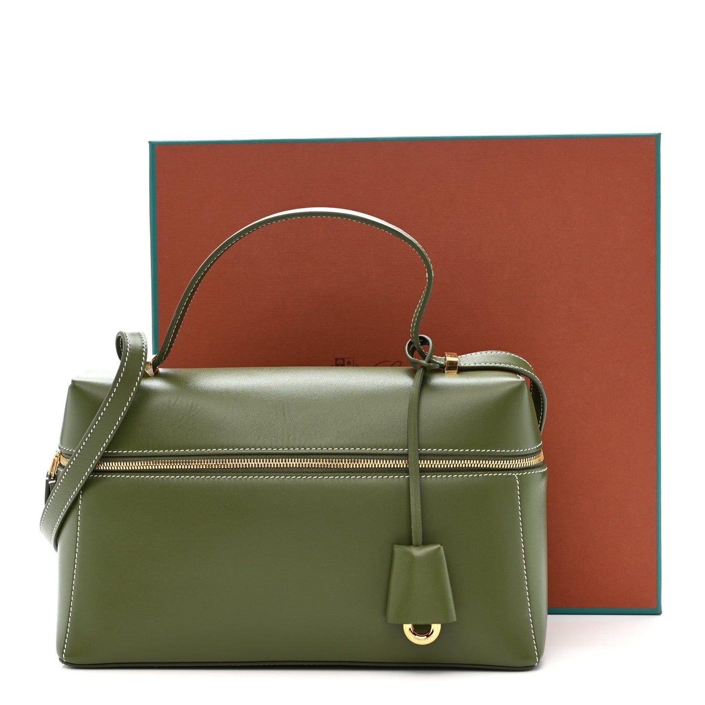 Olive green leather handbag with top handle, shoulder strap, gold zipper, and tassel