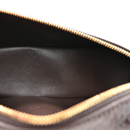 Loro Piana lizard leather pouch interior view with gold zipper trim, dark brown lining