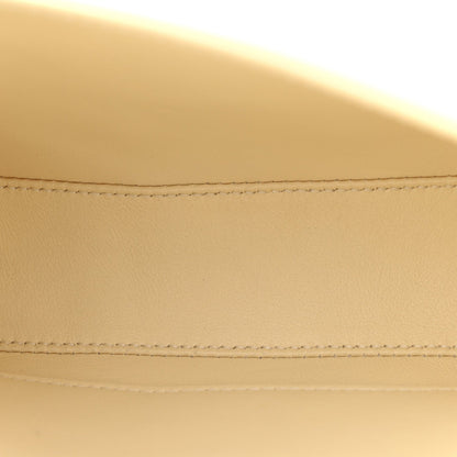 Close-up of nude calfskin flap stitching and neat seam detail