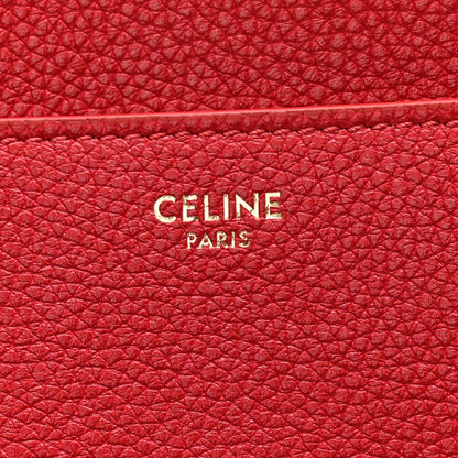Red grained leather panel with CELINE PARIS logo embossing