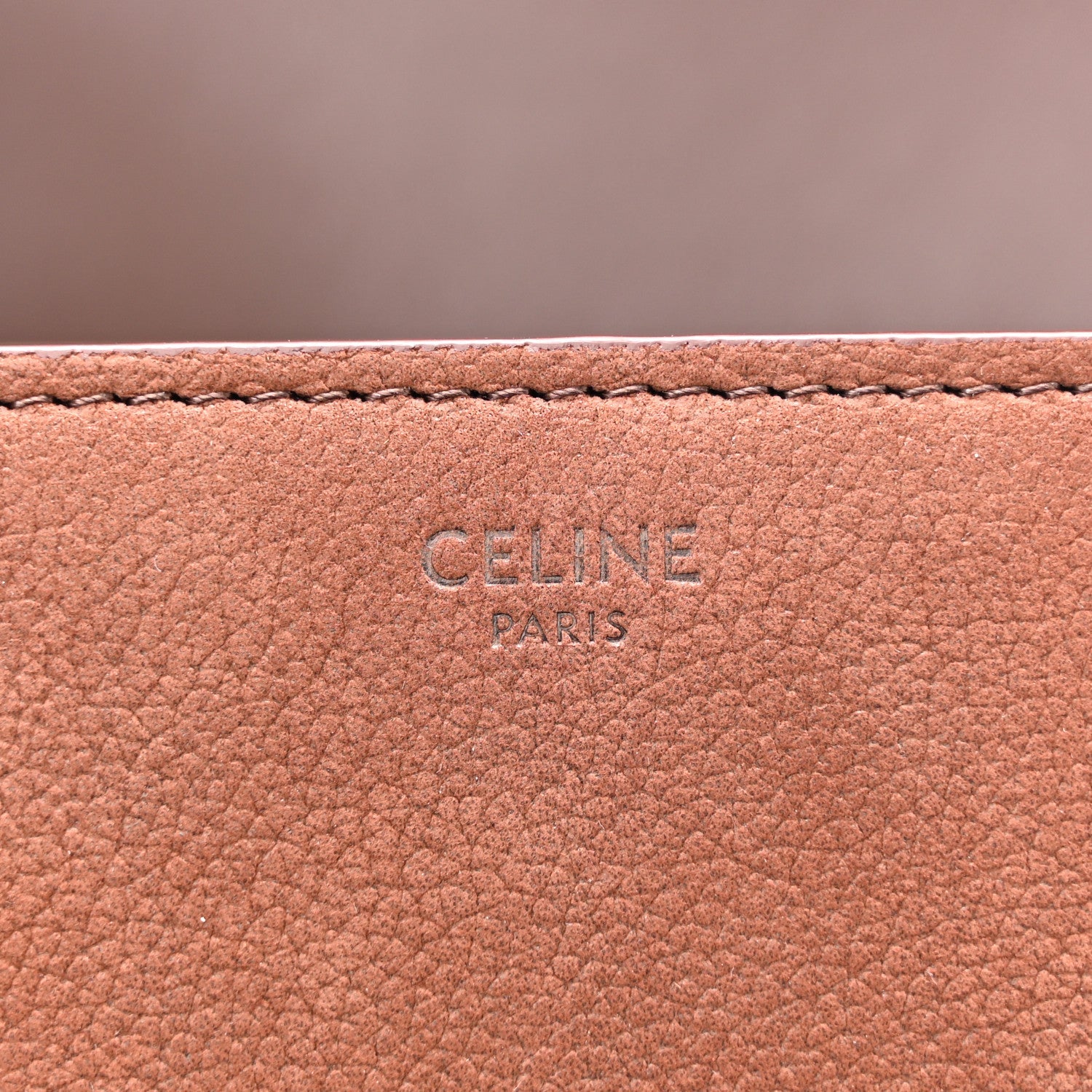 Chestnut leather interior panel with embossed CELINE PARIS lettering