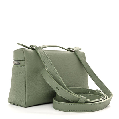 Sage green grained calfskin pouch with front zip and long crossbody strap