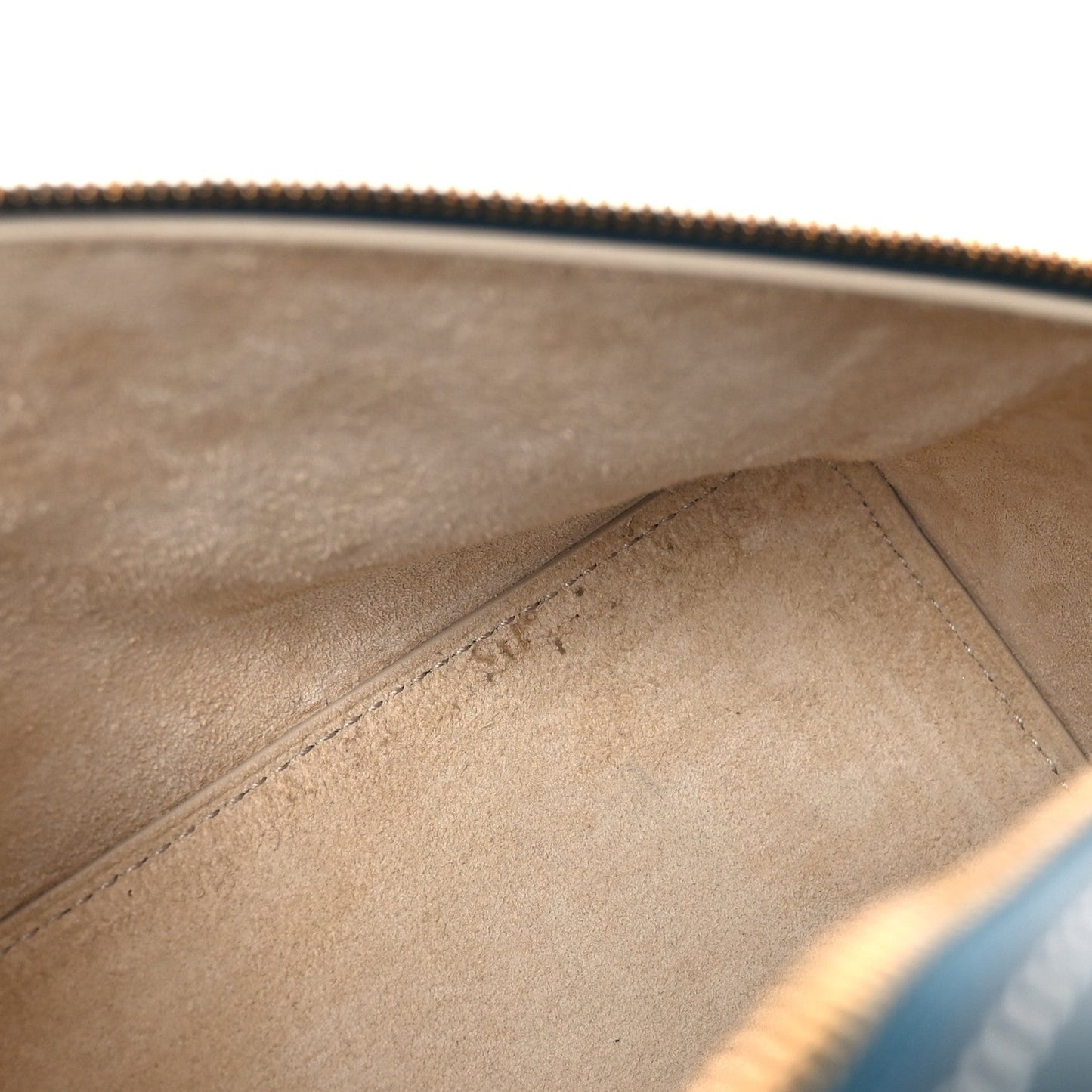 Petrolio teal leather bag interior closeup showing suede-like lining