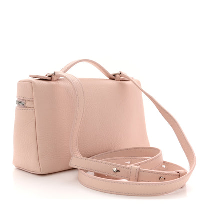 Light pink grained leather pouch with top handle and crossbody strap, front pocket