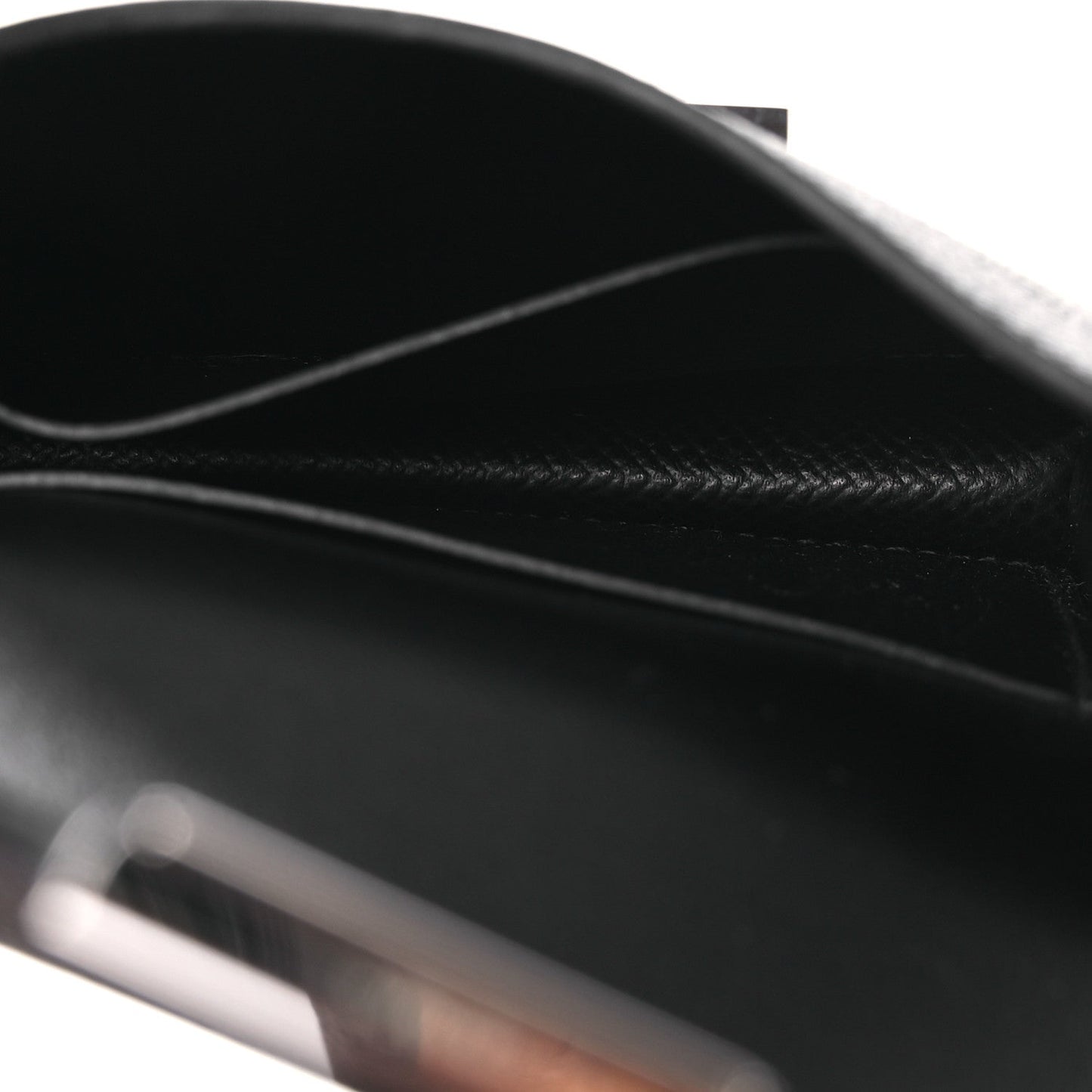 Black leather wallet interior with curved flap seam