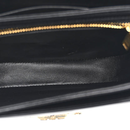 Black leather interior lining with stitched edges and gold-tone zipper track