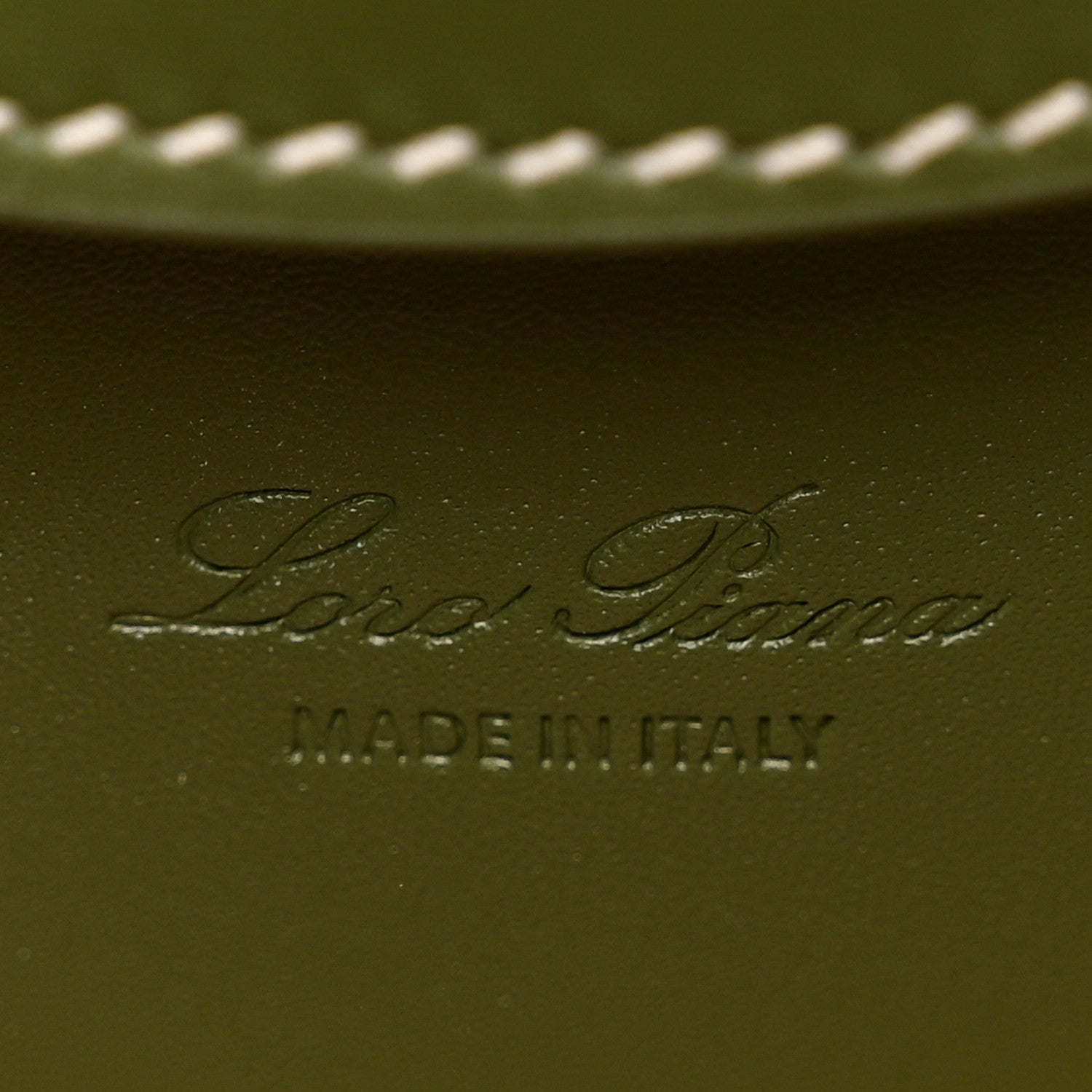 Olive green leather interior panel with embossed Loro Piana logo and MADE IN ITALY